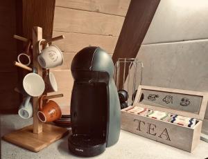 a hair dryer sitting next to a box of utensils at Duly Chalet in Kolašin
