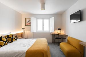Uma cama ou camas num quarto em Hotel Messeyne