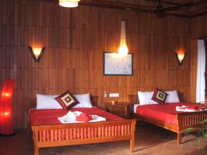 Ένα ή περισσότερα κρεβάτια σε δωμάτιο στο Green Plateau Lodge
