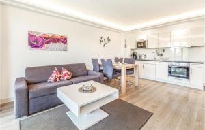 a living room with a couch and a table at Princess in Binz