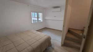 Postel nebo postele na pokoji v ubytování Rosesapparts A20deMar Triplex