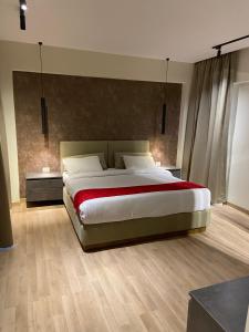 a large bedroom with a large bed in it at Cordoba Suites in Hurghada +43 photos