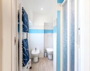 a bathroom with a toilet and a sink at Your Sea Escape in Riva Trigoso