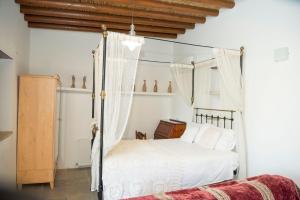 Postel nebo postele na pokoji v ubytování Kaizer Agrotourism