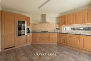 A kitchen or kitchenette at Chalet des Alpes - Sunset View - Crans-Montana