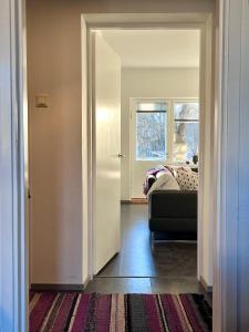 a room with a bedroom with a bed and a window at Cozy Condo in Käpylä in Helsinki