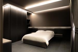 Postel nebo postele na pokoji v ubytování G-Rooms