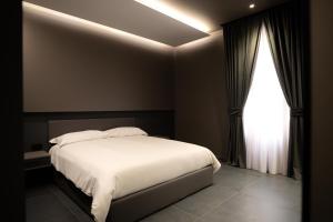 Postel nebo postele na pokoji v ubytování G-Rooms + 32 fotografií