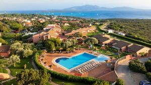 an aerial view of a villa with a swimming pool at Cala Rosa Club Hotel in Stintino