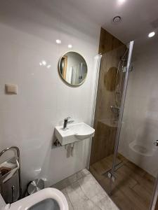 a bathroom with a toilet and a sink and a shower at PrzyStań S7 in Smroków