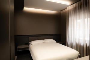 Postel nebo postele na pokoji v ubytování G-Rooms