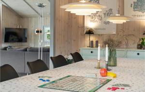 A television and/or entertainment centre at Awesome Home In Haderslev With Kitchen