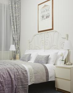 
Postel nebo postele na pokoji v ubytování Apartments Almandine

