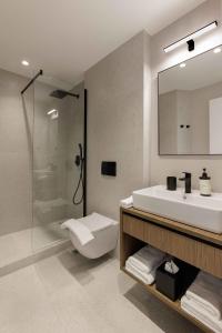 a bathroom with a toilet and a sink and a shower at master Plaka in Athens