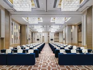 a large room with rows of chairs and tables at Langham Place Guangzhou - Walking distance to Canton Fair in Guangzhou +37 photos