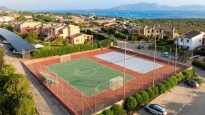 an aerial view of a tennis court with a soccer field at Cala Rosa Club Hotel in Stintino