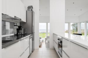 Η κουζίνα ή μικρή κουζίνα στο Villa Malspiikki, Kuuminainen