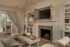 a living room with a fireplace and a tv at 2 Bedroom Wilson Village Home 5049 in Bluffton