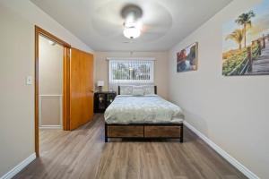 a bedroom with a bed in the middle of a room at Modern Cozy 1Bedroom Apartment Shelby Township Retreat in Shelby