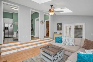 a living room with a couch and a table at 4BR on Henderson - Walk to USC in Columbia