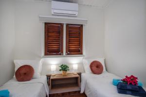 Ένα ή περισσότερα κρεβάτια σε δωμάτιο στο Bloublou Apartments Curaçao