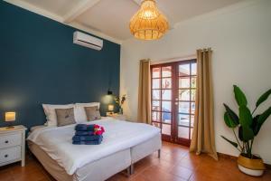 Ένα ή περισσότερα κρεβάτια σε δωμάτιο στο Bloublou Apartments Curaçao