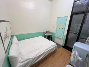 Voodi või voodid majutusasutuse Chaonima B&B 潮尼馬民宿 toas