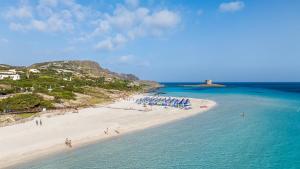 an aerial view of a beach with people in the water at Cala Rosa Club Hotel in Stintino
