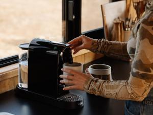 a person is typing on a coffee machine at Heyscape Denmark in Denmark +11 photos