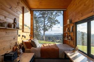 a bedroom with a bed and a large window at Heyscape Denmark in Denmark