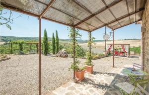 a patio with a table and a swing at La Casa Della Fata in Montenero