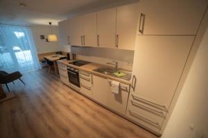 Kuchyň nebo kuchyňský kout v ubytování Haus Bazigg + 27 fotografií