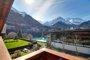 a house with a view of the mountains at Lodge 8 Next To Ski Lift And Sportcenter in Champéry