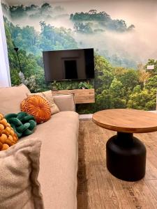 a living room with a couch and a table at BILBAO NORTH SHORE APARTMENTS in Bilbao