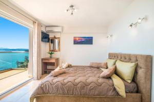 Posteľ alebo postele v izbe v ubytovaní Villa Poseidon Seaside by Villa Plus + 20 fotografií