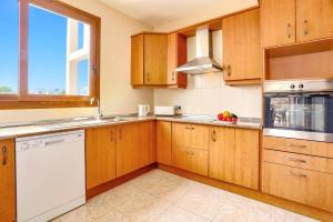 A kitchen or kitchenette at Villa Cala Nit by Villa Plus