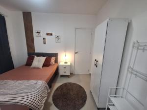 Postel nebo postele na pokoji v ubytování Apartamento com suíte