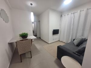 TV a/nebo společenská místnost v ubytování Apartamento com suíte