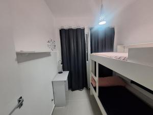 Postel nebo postele na pokoji v ubytování Apartamento com suíte