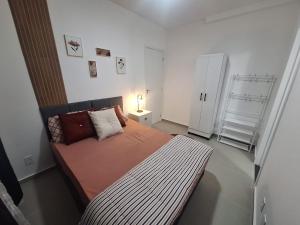 Postel nebo postele na pokoji v ubytování Apartamento com suíte