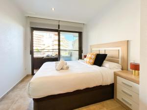 Posteľ alebo postele v izbe v ubytovaní Myflats Deluxe Balcon de Arenales