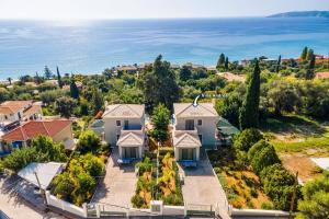 an aerial view of a house with the ocean at Villa Andrea by Villa Plus in Lourdhata