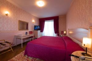TV a/nebo společenská místnost v ubytování Hotel Catullo