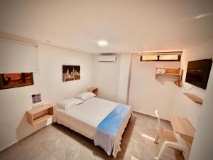 Postel nebo postele na pokoji v ubytování Hotel La Estrella de David Cartagena