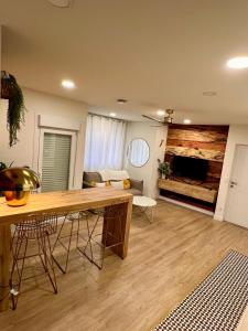 a living room with a table and a couch at BILBAO NORTH SHORE APARTMENTS in Bilbao