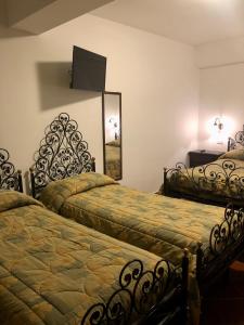 Posteľ alebo postele v izbe v ubytovaní Hotel Bucaneve