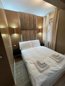 Ένα ή περισσότερα κρεβάτια σε δωμάτιο στο Trento best home