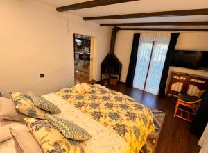 Un pat sau paturi într-o cameră la Casa de Adonay