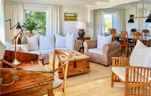 a living room with a couch and a table at Vesthassel-Nesheim in Borhaug