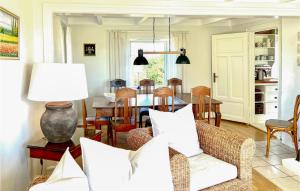 a living room with a couch and a table at Vesthassel-Nesheim in Borhaug